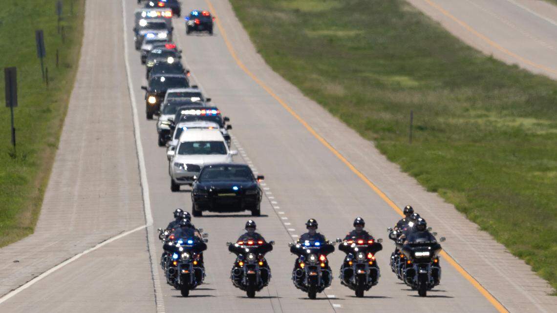 A procession of law enforcement vehicles lead the body of Phillips County Sheriff Deputy Brandon Gaede out of Wichita and back to Phillipsburg, where he was shot and killed during a call on Friday evening.