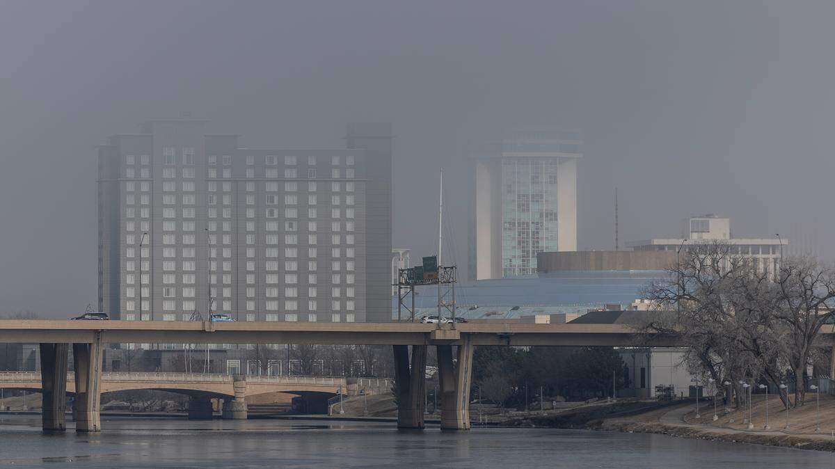 Downtown Wichita remained shrouded in fog late into the morning Wednesday. A storm system is expected to move into the area overnight Thursday, potentially bringing 2-4 inches of snow along with it. 