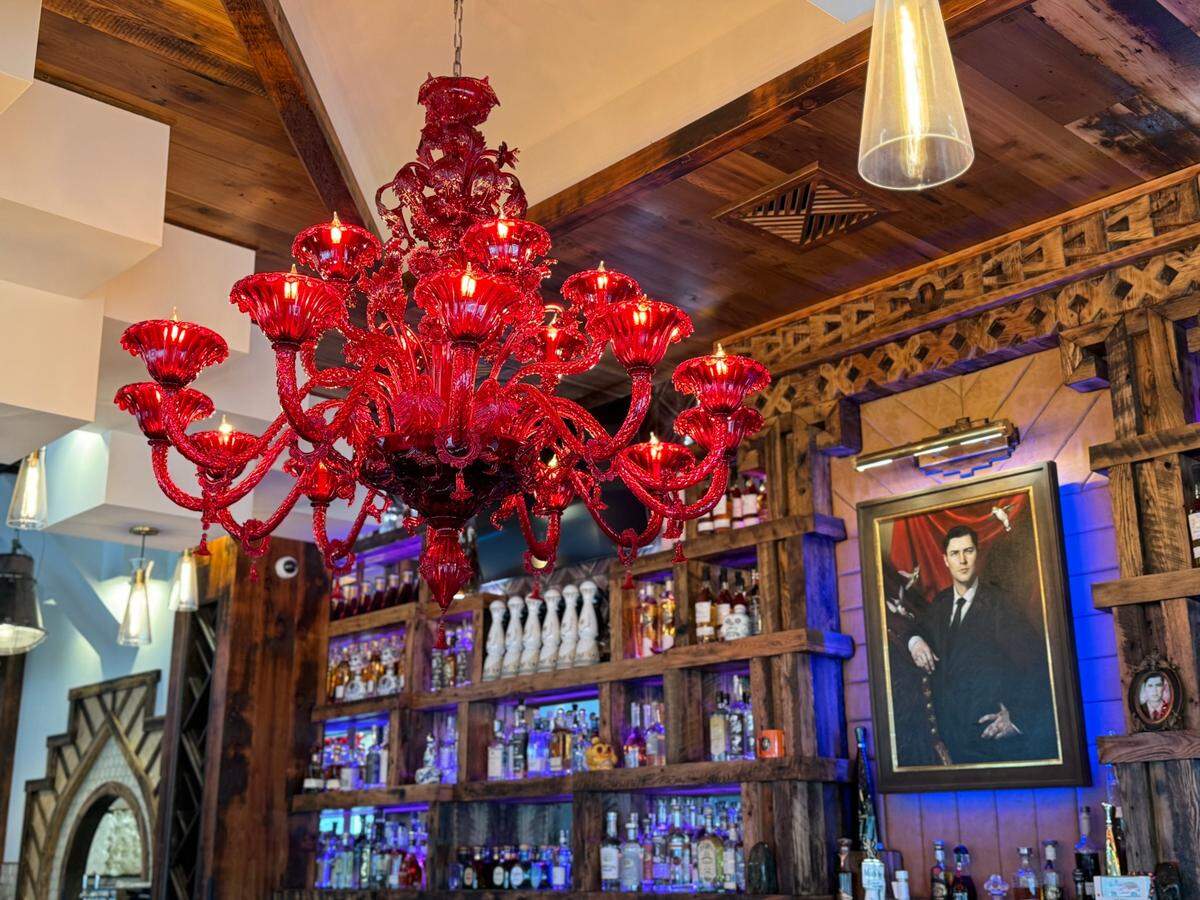 A portrait of Victoria Haeri’s late grandfather hangs behind the bar at Itzcali Tapas & Tequila.