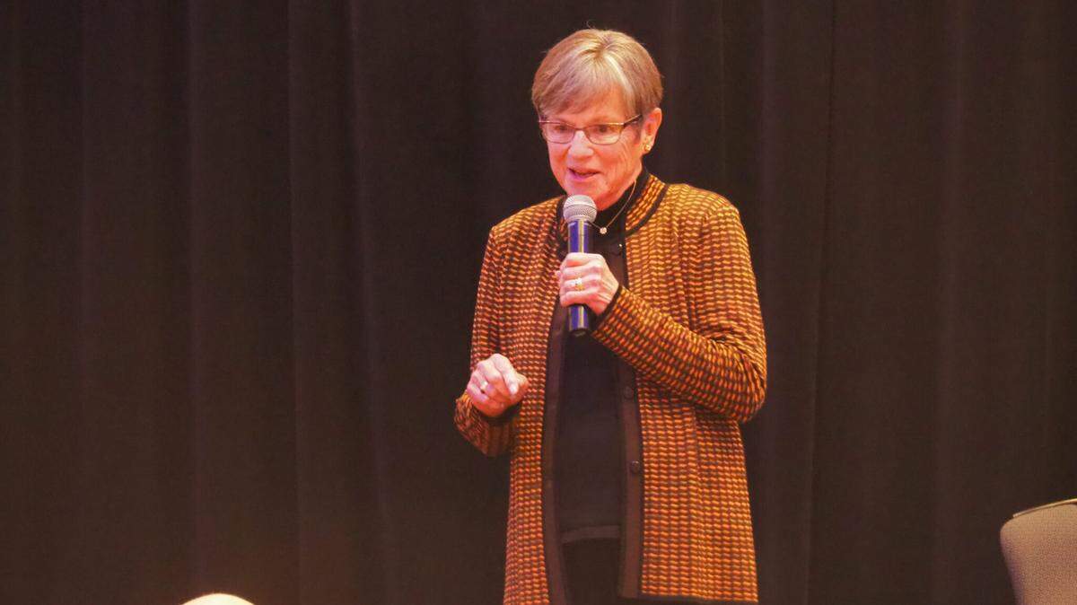 Gov. Laura Kelly, a Democrat, has filed a lawsuit against Republican Attorney General Kris Kobach alleging that he seeks to unconstitutionally block her from a role in determining the best interests of Kansas in terms of action in state or federal courts. In this Sept. 24, 2025, image, Kelly speaks to Kansans during gathering in Johnson County.