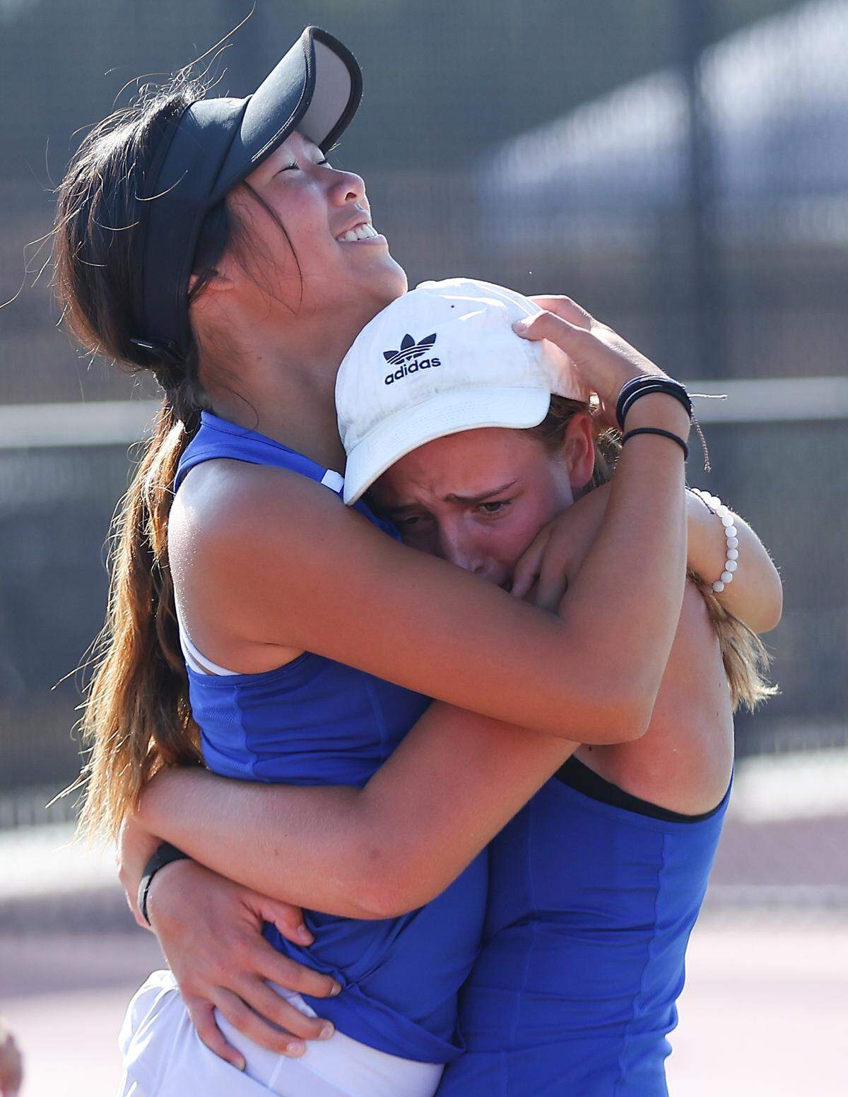 Elizabeth Gaddis (right) celebrates with Andover teammate Ada Tantemsomboon (left) after the team won the Class 5A team state title.