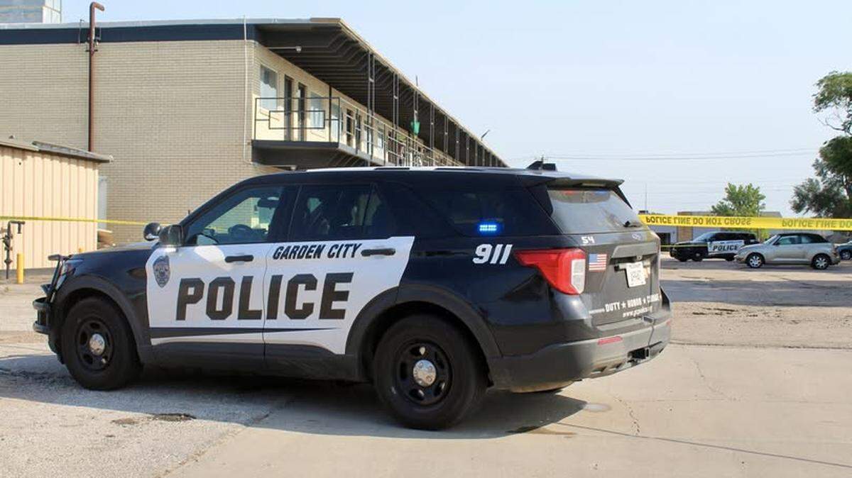 A Garden City police cruiser sits outside of the Continental Apartments. Police cordoned off the complex after a fatal shooting there Wednesday.