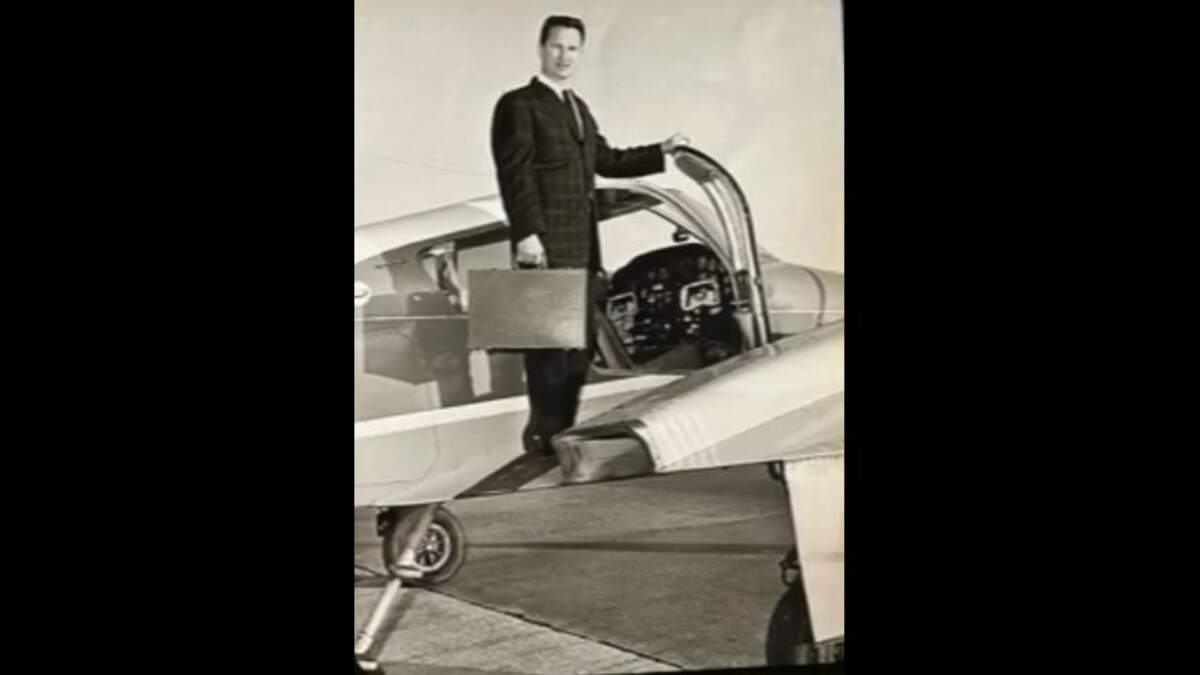 Ronald “Roe” Messner poses next to the plane he used to travel from Wichita to jobs building churches all over the country.