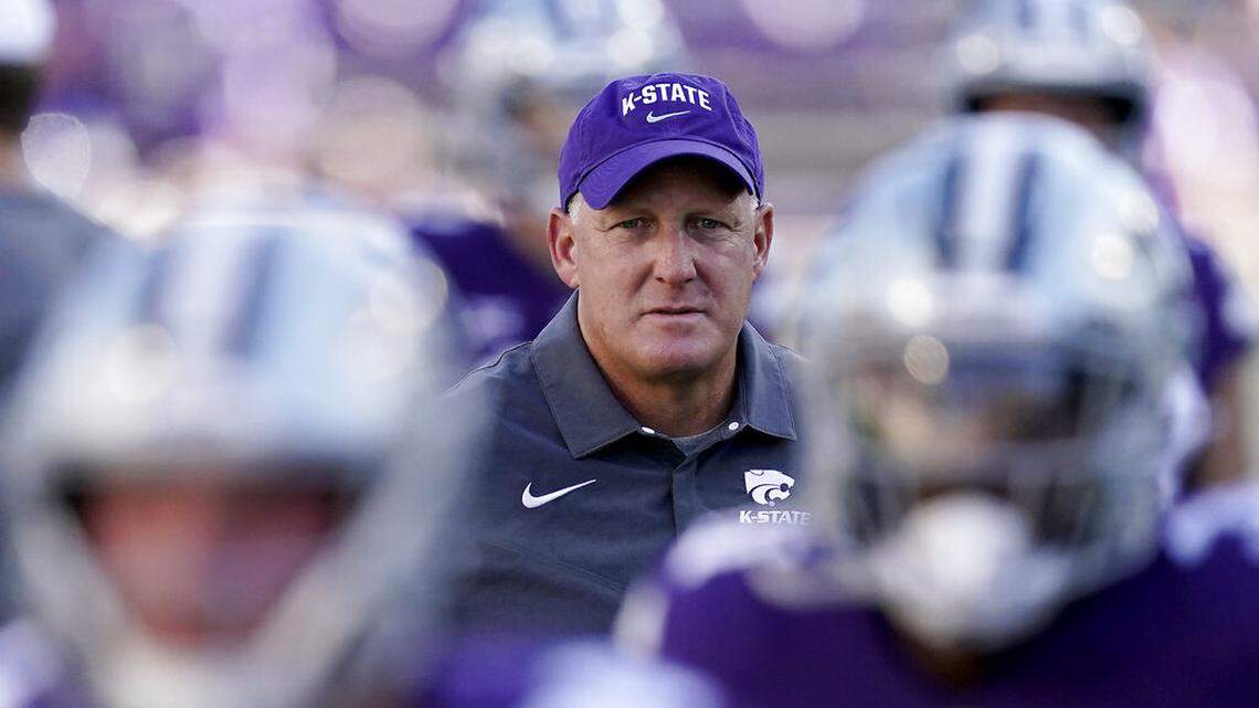Kansas State head coach Chris Klieman watches his players warmup before an NCAA college football game against South Dakota Saturday, Sept. 3, 2022, in Manhattan, Kan. (AP Photo/Charlie Riedel)