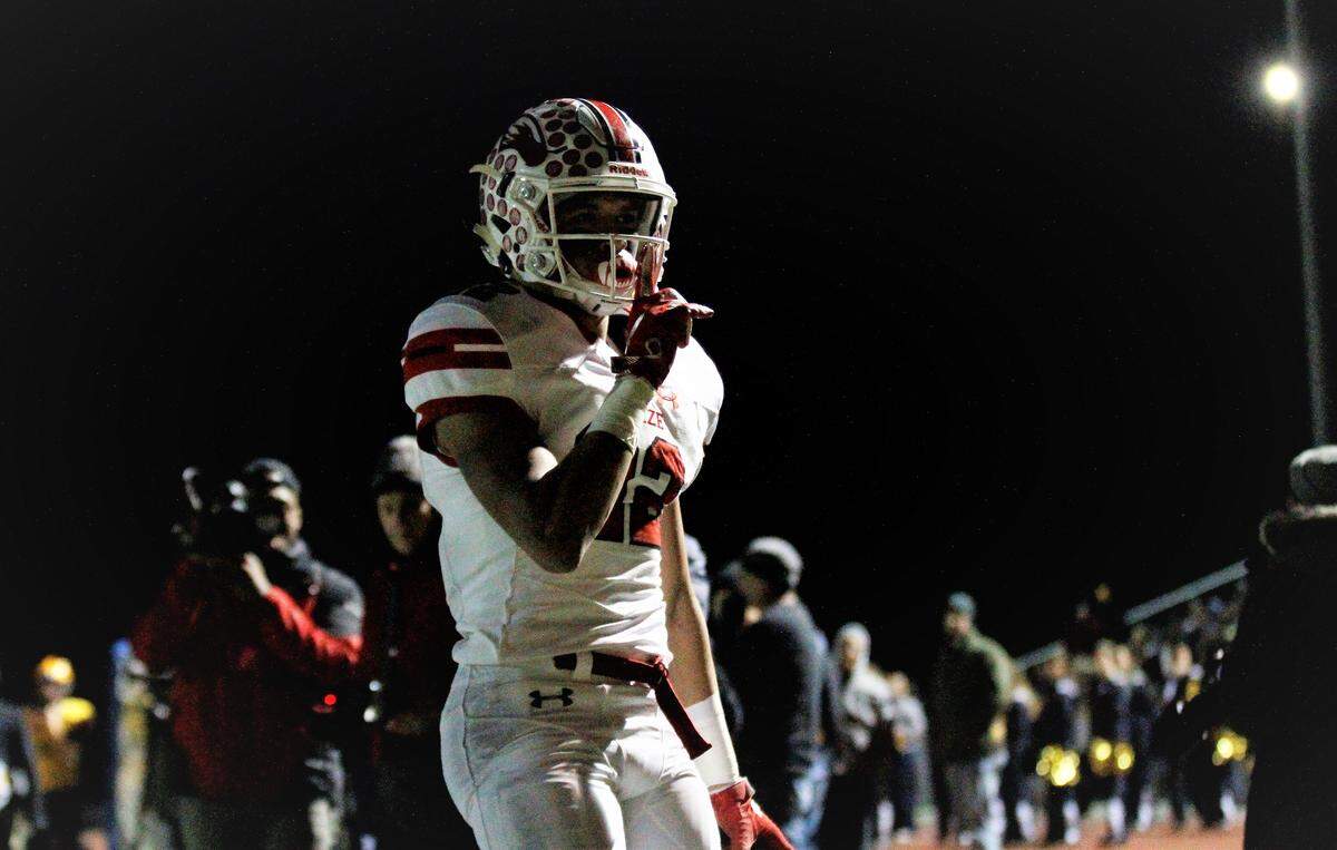 Maize junior receiver Preven Christon shushes the crowd after scoring a pivotal touchdown in the Eagles’ state semifinal game against Wichita Northwest on Friday. (Nov. 16, 2018)