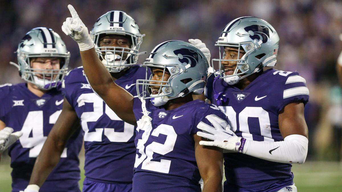 Kansas State Wildcats linebacker Desmond Purnell (32) celebrates an interception in the third quarter against the TCU Horned Frogs at Bill Snyder Family Football Stadium.