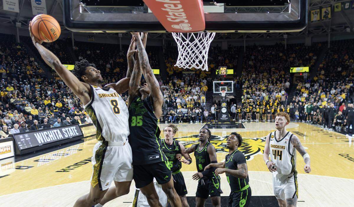 Dillon Battie goes up for a dunk against South Florida’s Izaiyah Nelson during the second half at Koch Arena on Wednesday night.