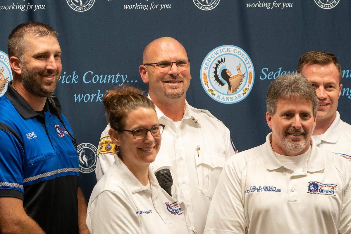 Kevin Lanterman, center, is photographed with Sedgwick County EMS personal after he was named director of emergency medical services. His appointment comes 11 months after the department’s controversial ex-director resigned. (June 16, 2022)