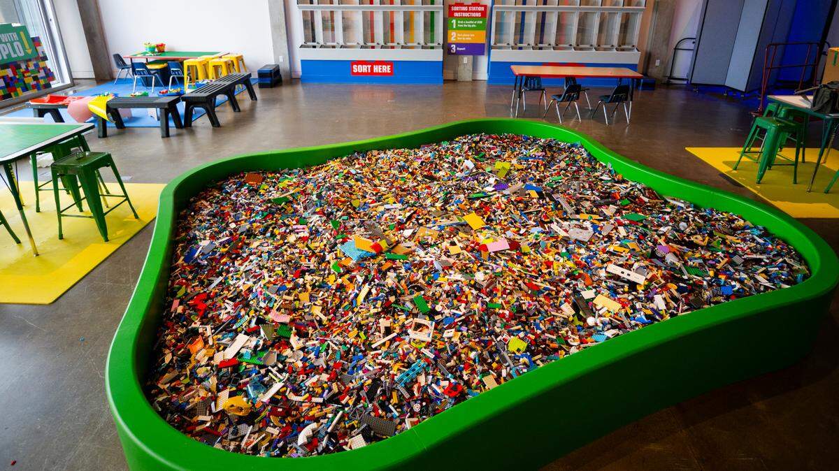 Exploration Place’s “Bricktopia” exhibit features an interactive pit filled with 3,300 pounds of Lego bricks.