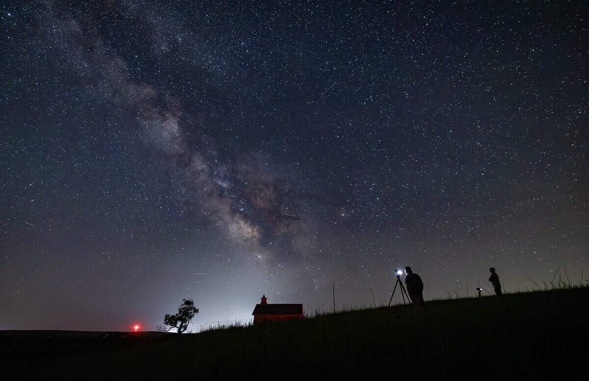 The Milky Way galaxy can be seen in the southern sky from the Lower Fox Creek Schoolhouse at the Tallgrass Prairie Preserve on Tuesday night. The galaxy is best viewed away from city lights in the summer, when the earth's orbital position faces the galaxy's star-filled core.