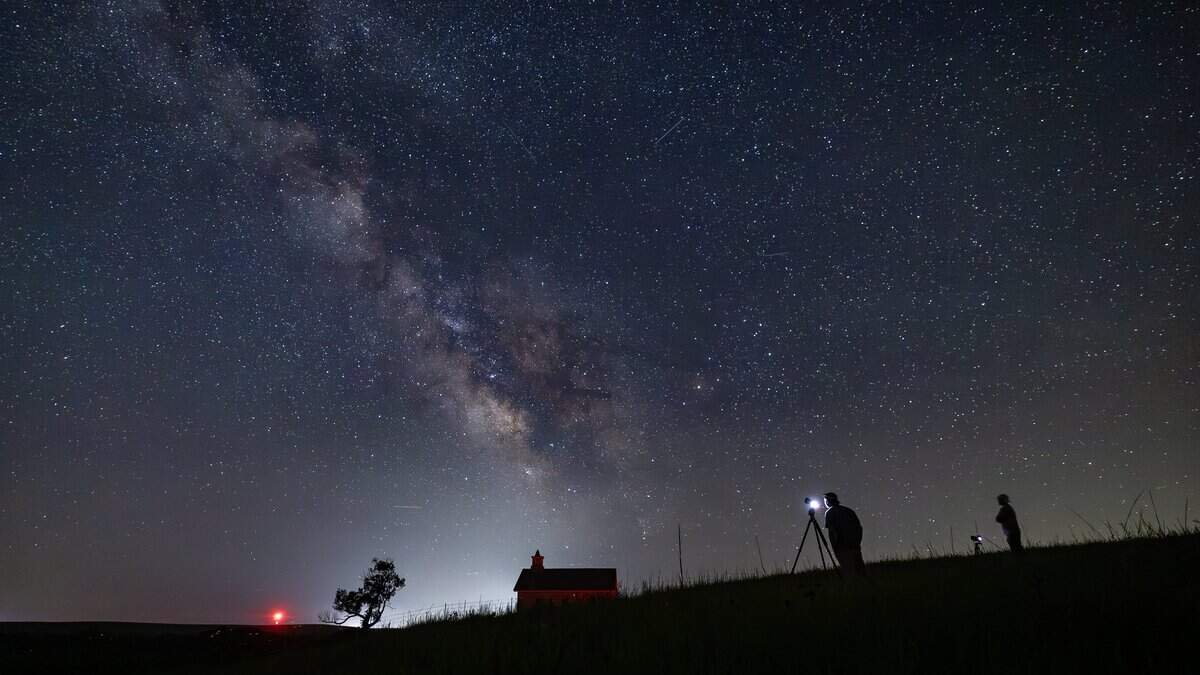 The Milky Way galaxy can be seen in the southern sky from the Lower Fox Creek Schoolhouse at the Tallgrass Prairie Preserve on Tuesday night. The galaxy is best viewed away from city lights in the summer, when the earth's orbital position faces the galaxy's star-filled core.