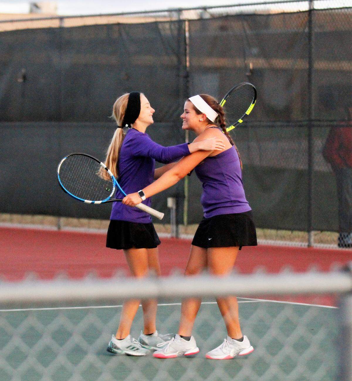 Arkansas City’s Jacey Arnett (left) and Kelsie Burr (right) celebrate their 2018 Kansas Class 5A state championship Saturday in Emporia. (Oct. 13, 2018)