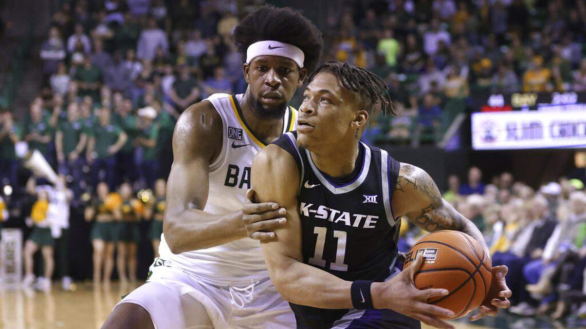 Kansas State forward Keyontae Johnson (right) drives to the basket against Baylor forward Flo Thamba in the first half Saturday, Jan. 7, 2023, in Waco, Texas.
