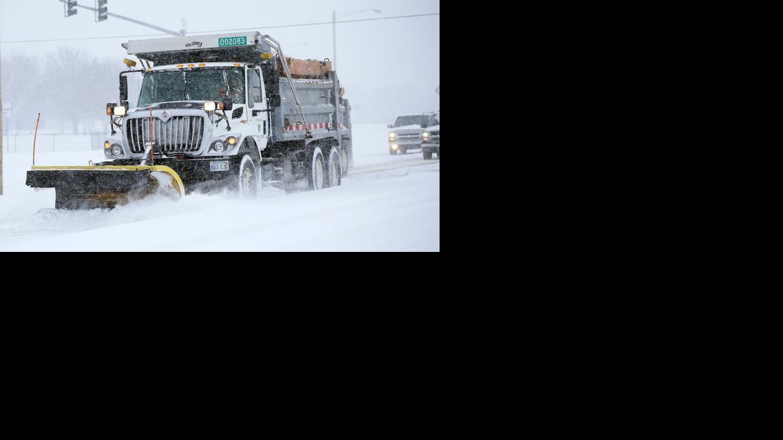 Wichita city snow plow works its way north on Meridian on Feb. 4, 2014.

