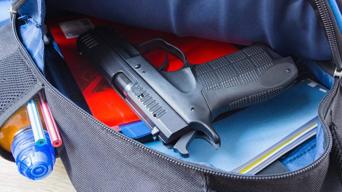 A gun inside a backpack