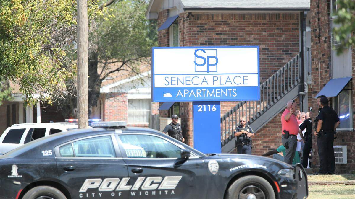 Wichita police officers and detectives at the Seneca Place Apartments after a man was found shot to death in his apartment in 2023.
