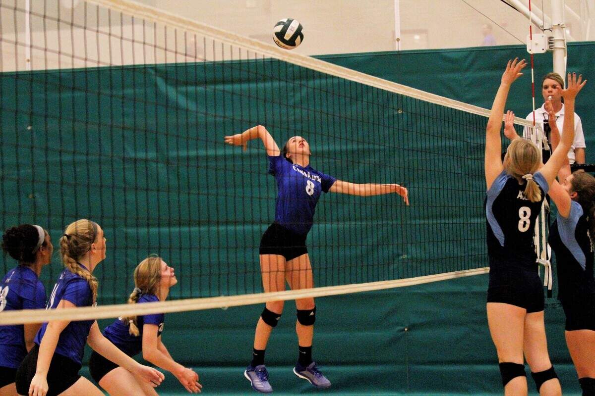 Kapaun’s Gracie Becker goes for a spike during the Crusaders’ triangular with Bishop Carroll and Wichita East on Tuesday. (Sept. 4, 2018)