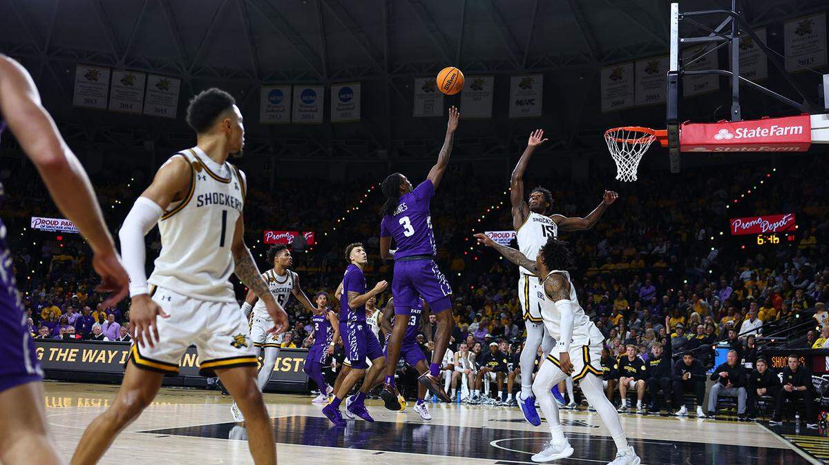Kansas State basketball player CJ Jones goes up for a shot against Wichita State.