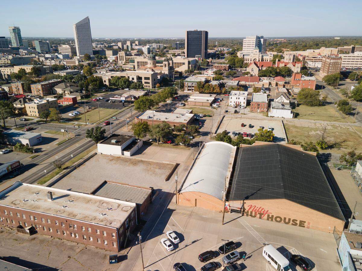 Nifty Nut House owner Steve Jahn plans to demolish an apartment complex, which is south of the store at 520 E. Central, for a parking lot.