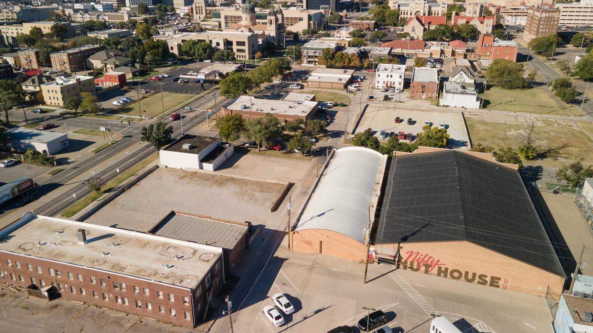 Nifty Nut House owner Steve Jahn plans to demolish an apartment complex, which is south of the store at 520 E. Central, for a parking lot.