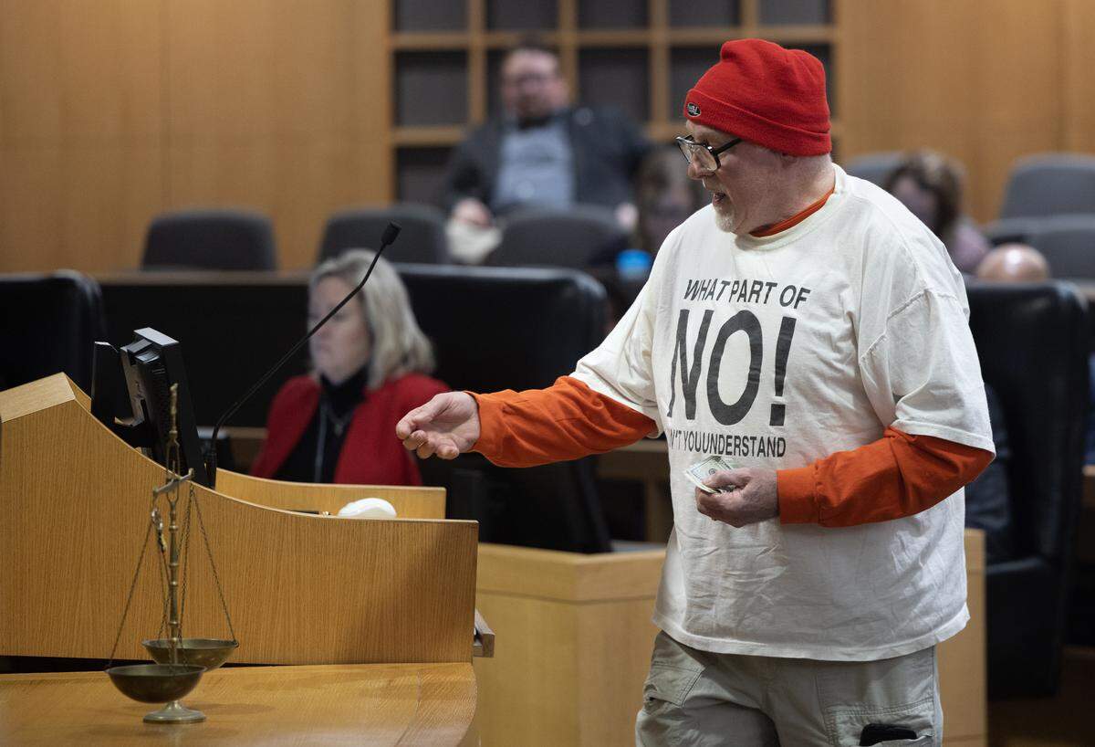 George Theoharis brought a scale to make his point during public comments about the proposed 1% sales tax vote next month.
