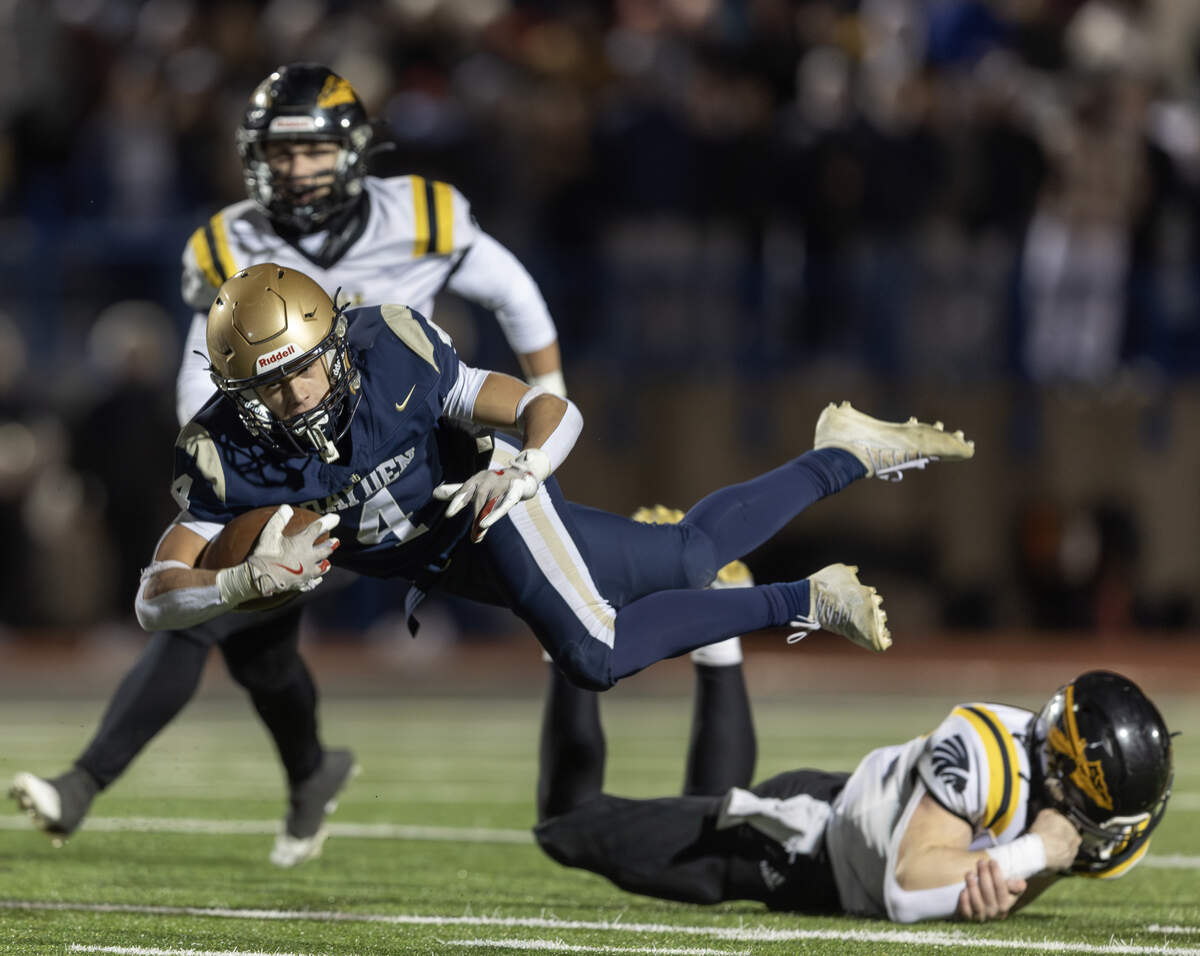 Topeka Hayden running back Mason Becker is upended during the second quarter against Andale. The Indians beat Topeka Hayden 38-6 on Friday night in Hutchinson to win the 3A state title.