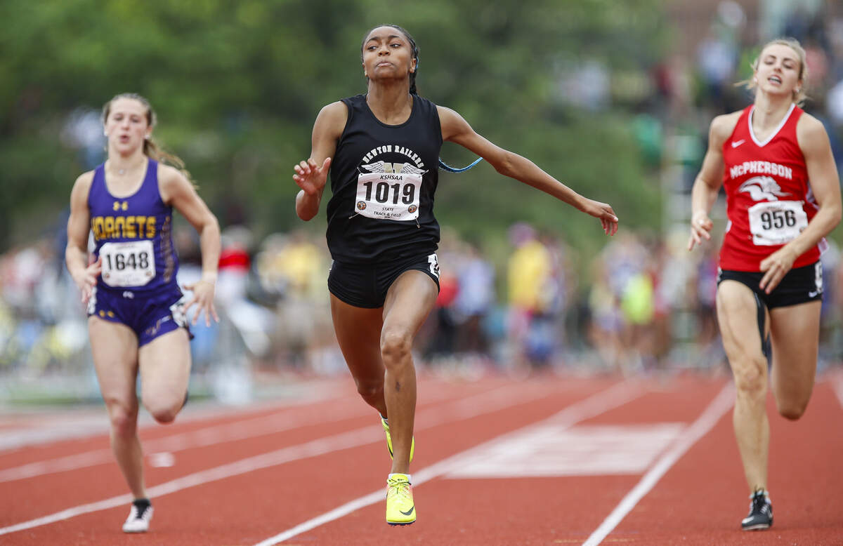 Newton’s Kalli Anderson (center) won the Class 5A 100 meter dash with a time of 11.81 seconds at the state track meet on Saturday at Cessna Stadium. (May 25, 2019)