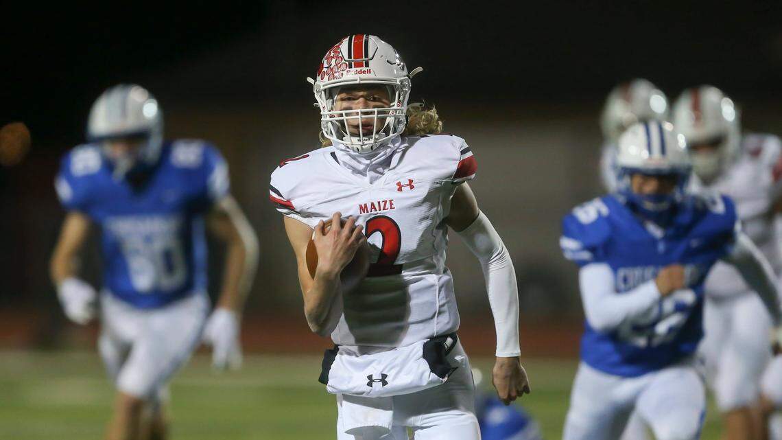 Maize quarterback Avery Johnson runs for a long touchdown during the first half of their game against Kapaun Mt. Carmel on Friday. Maize won 22-21 to earn a spot in next weekÕs 5A state championship game.