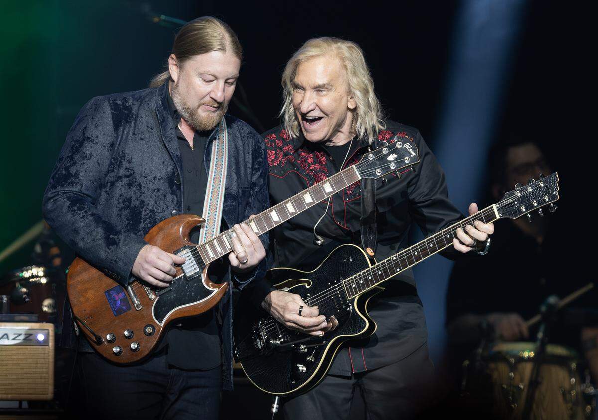 Joe Walsh plays alongside renowned slide guitarist Derek Trucks at Walsh’s VetsAid concert at Intrust Bank Arena on Saturday night. The benefit concert raised money for local and regional veteran organizations.