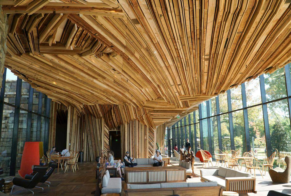 The Gathering Place is a nearly 100-acre public park in Tulsa that opened a year ago. The main building has been described as a ‘ski lodge on steroids’ with wood ceilings and funky furniture and fireplaces. There is no charge to admission to the park.