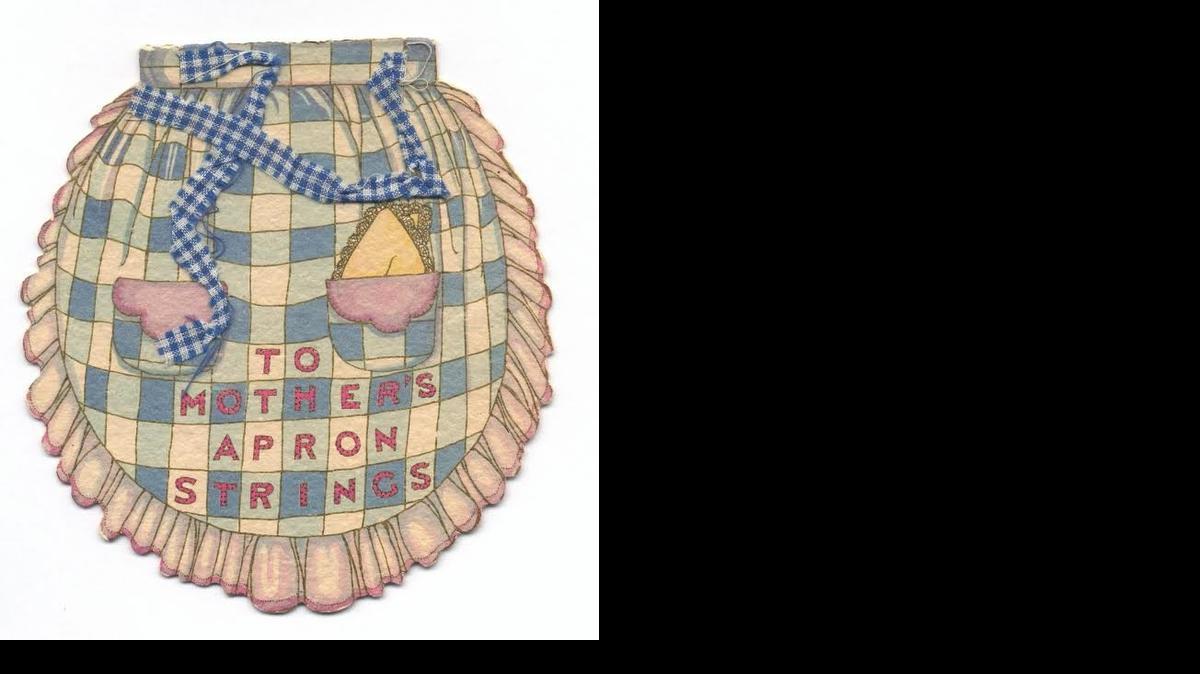 The apron strings on this card from the late 1920s were actual fabric. Such attachments weren’t unusual. Some cards featured lace, tissue paper or pressed dried flowers.

