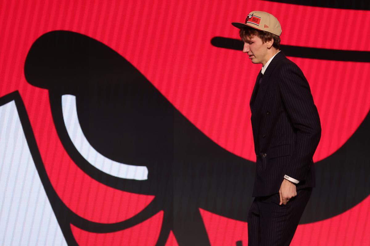 Former Sunrise Christian star Matas Buzelis walks on stage after being selected in the first round by the Chicago Bulls in the 2024 NBA Draft at Barclays Center.