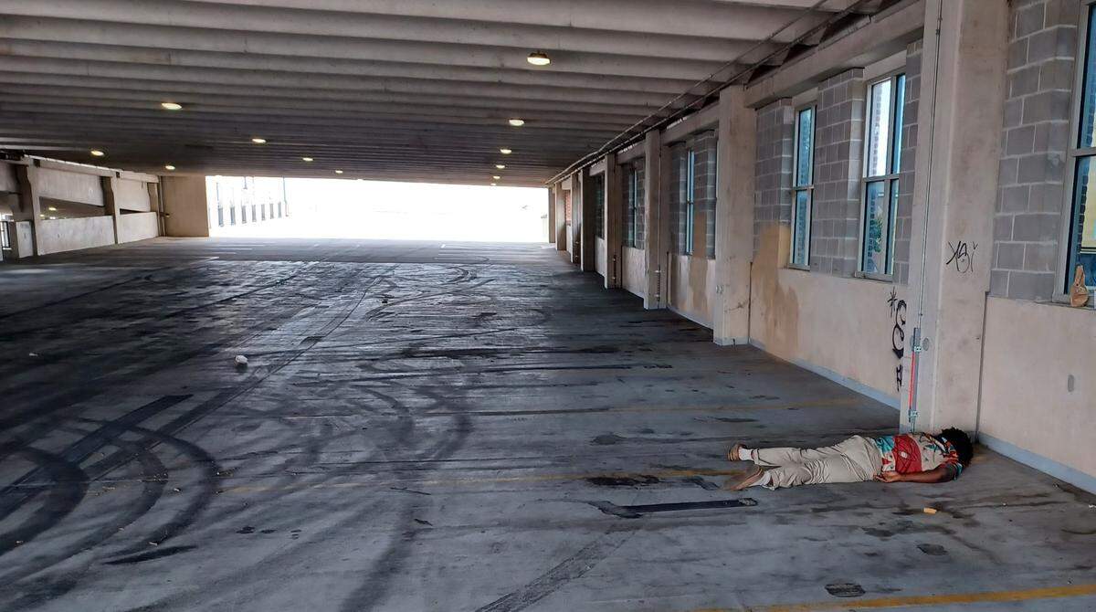 The city of Wichita installed concrete barriers at the Old Town Cinema parking garage, but it remains open to foot traffic and appears to be a popular place to take a nap. On a recent Wednesday afternoon, one man could be observed napping in the blockaded garage.