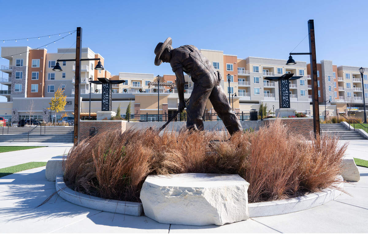 This statue at Heritage Plaza features a man with a shovel, which is the centerpiece of the overall Heritage development’s branding.