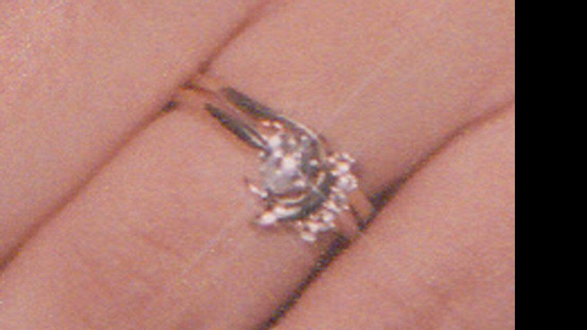 This ring was stolen from Danielle Zimmerman who suffered a fatal brain aneurysm at a Taco Bell drive-through on East Harry.  Police are still looking for the ring.  