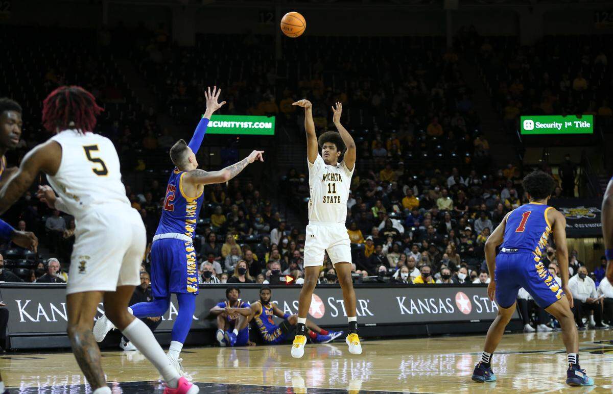 Wichita State’s Kenny Pohto hits a three-pointer against Tulsa during the first half of their game on Tuesday night at Koch Arena.