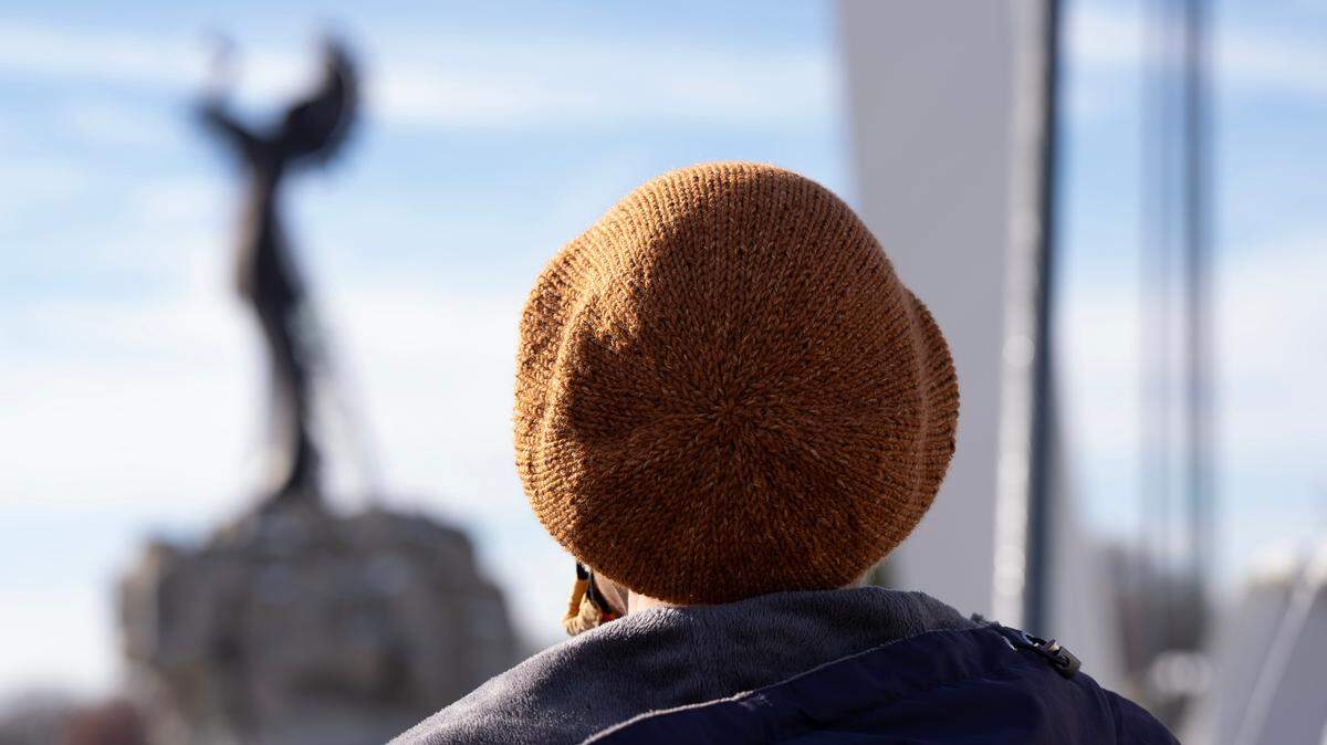 Mina Lukas looks out over the Keeper of the Plains statue in downtown Wichita.
