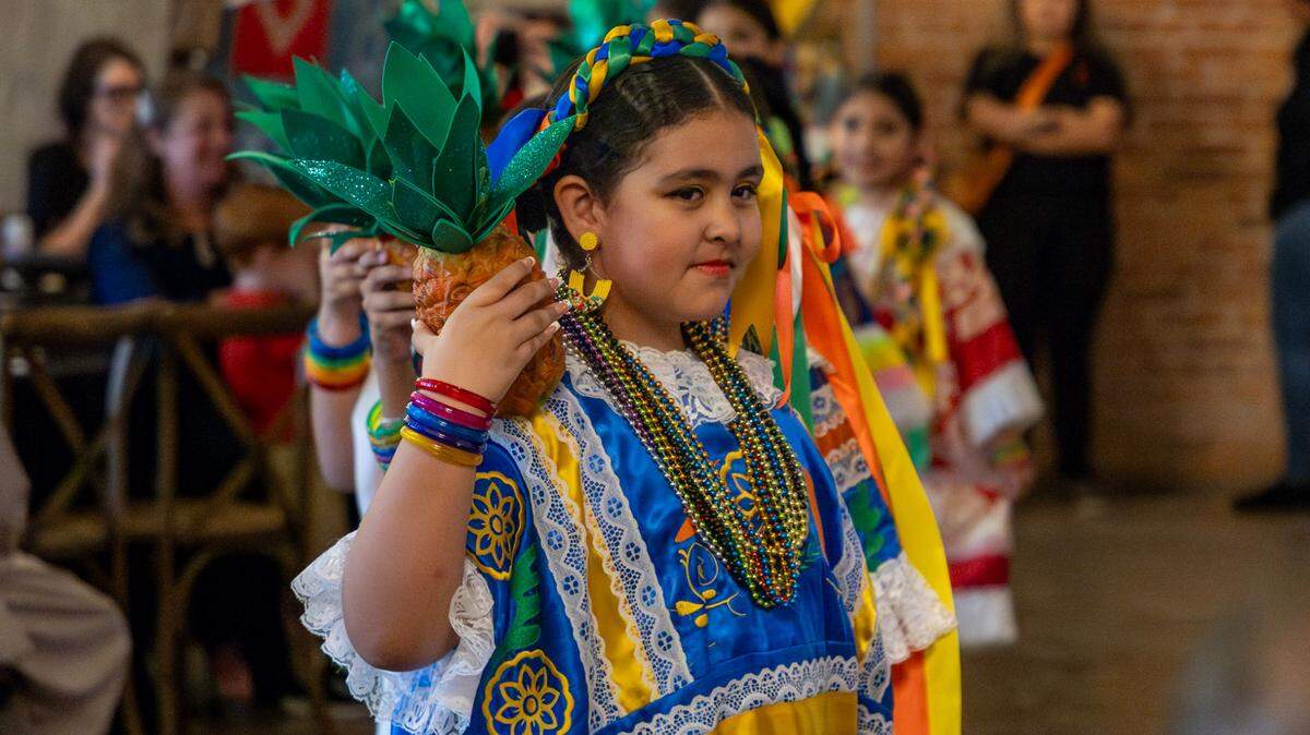 The children’s troupe Raices de mi Tierra performs a Central American folkloric dance at the gala for the International Rescue Committee.
