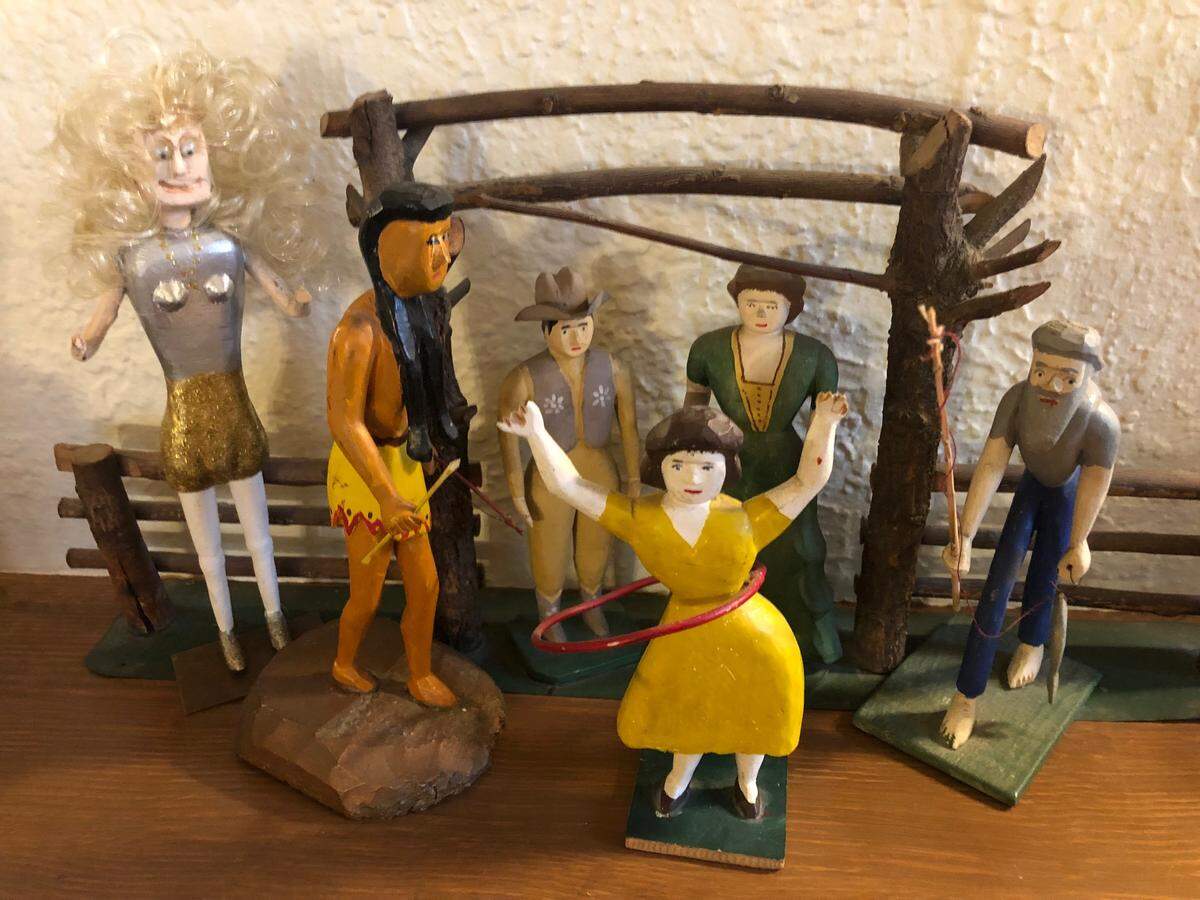 Larry Schwarm’s many collections include these hand-carved wooden figures.