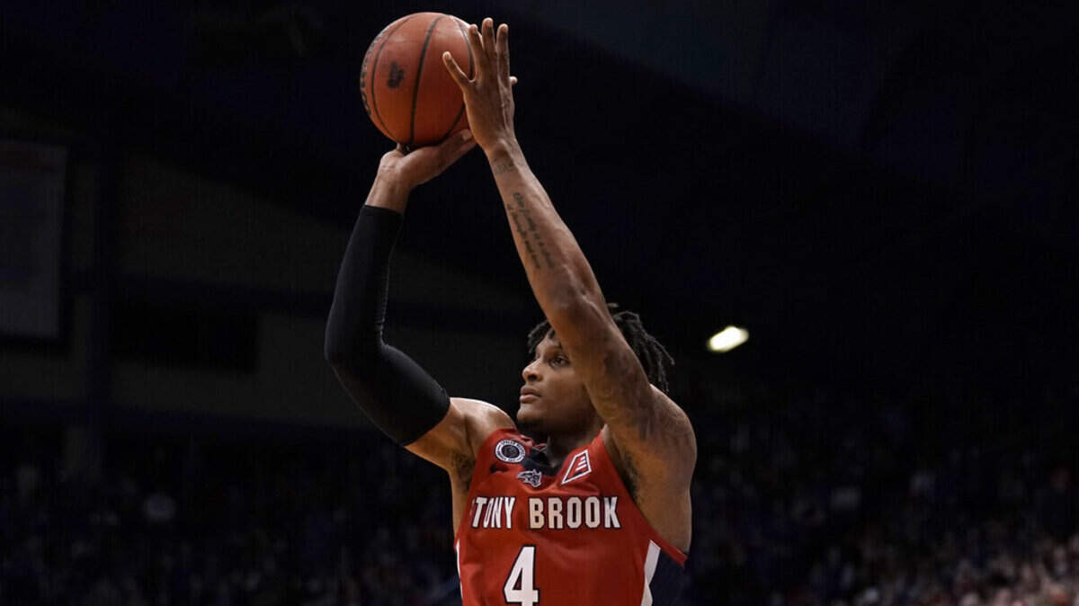 Stony Brook’s Tykei Greene shoots during the second half of an NCAA college basketball game against Kansas Thursday, Nov. 18, 2021, in Lawrence, Kan. (AP Photo/Charlie Riedel)