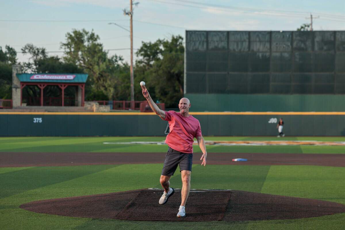 Local doctor James Walker threw out the first pitch on Thursday at the National Baseball Congress World Series, a tournament he played in during the 1991 summer.
