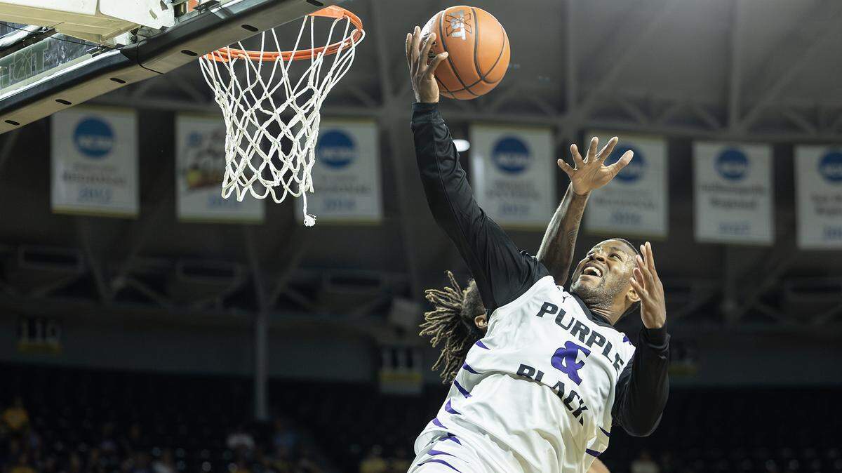 Marcus Foster, playing for the Kansas State alumni team Purple and Black, is fouled during the fourth quarter against DaGuys STL on July 20, 2023.