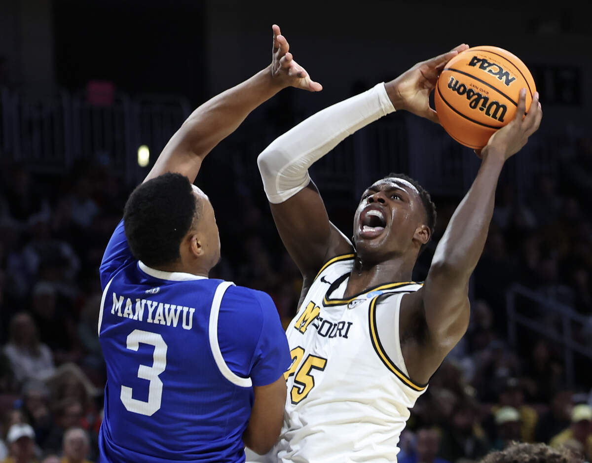 Missouri’s Mark Mitchell shoots against Drake forward Cam Manyawu during the first half of their NCAA Tournament game in Wichita on Thursday, March 20, 2025.