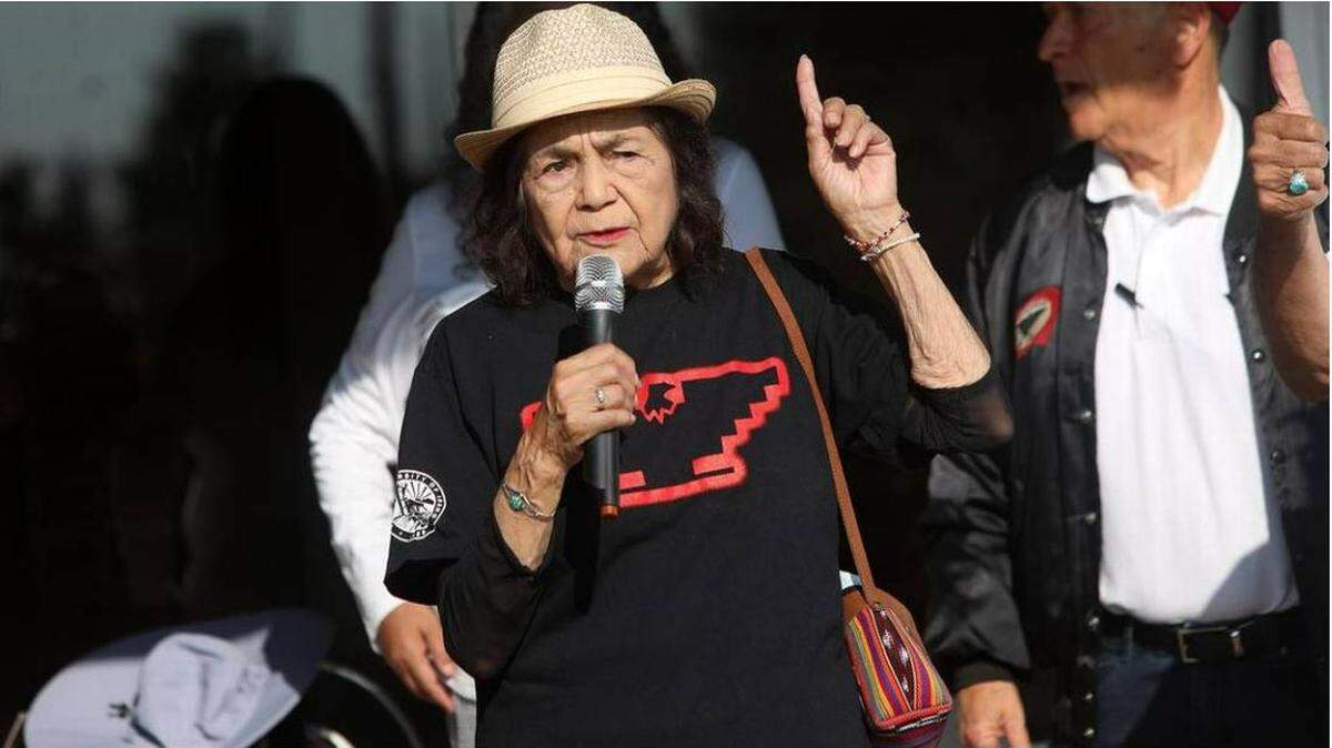 Dolores Huerta, 92, who co-founded the United Farm Workers union with Cesar Chavez, shown here at a California rally, spoke to a Wichita crowd Saturday about community organizing.