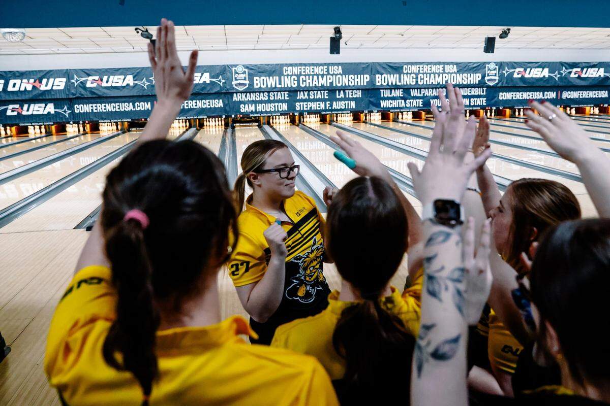 The Wichita State women’s bowling team celebrates during its run to the Conference USA championship on Sunday.