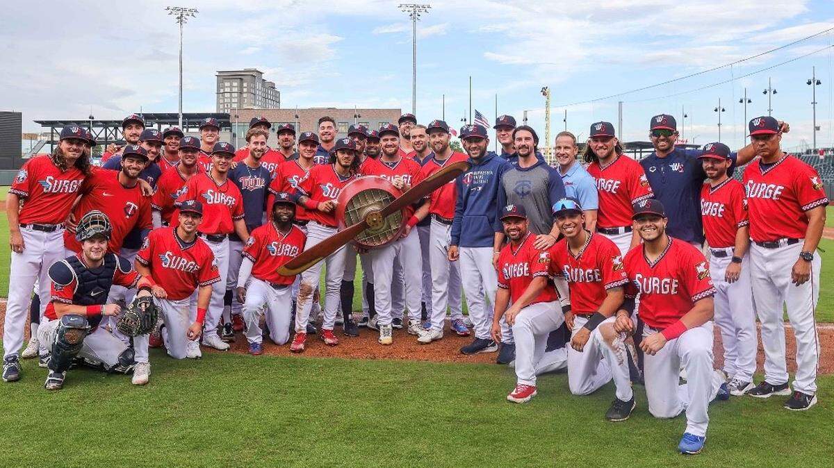 The Wichita Wind Surge celebrate with the propeller trophy after winning the season series against Tulsa. The Wind Surge are now in the playoff chase at home.