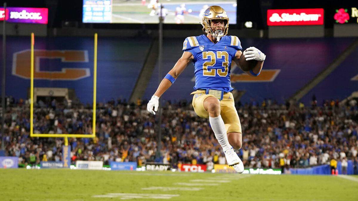 UCLA wide receiver Chase Cota (23) scores during the second half of an NCAA college football game against LSU Saturday, Sept. 4, 2021, in Pasadena, Calif. (AP Photo/Marcio Jose Sanchez)