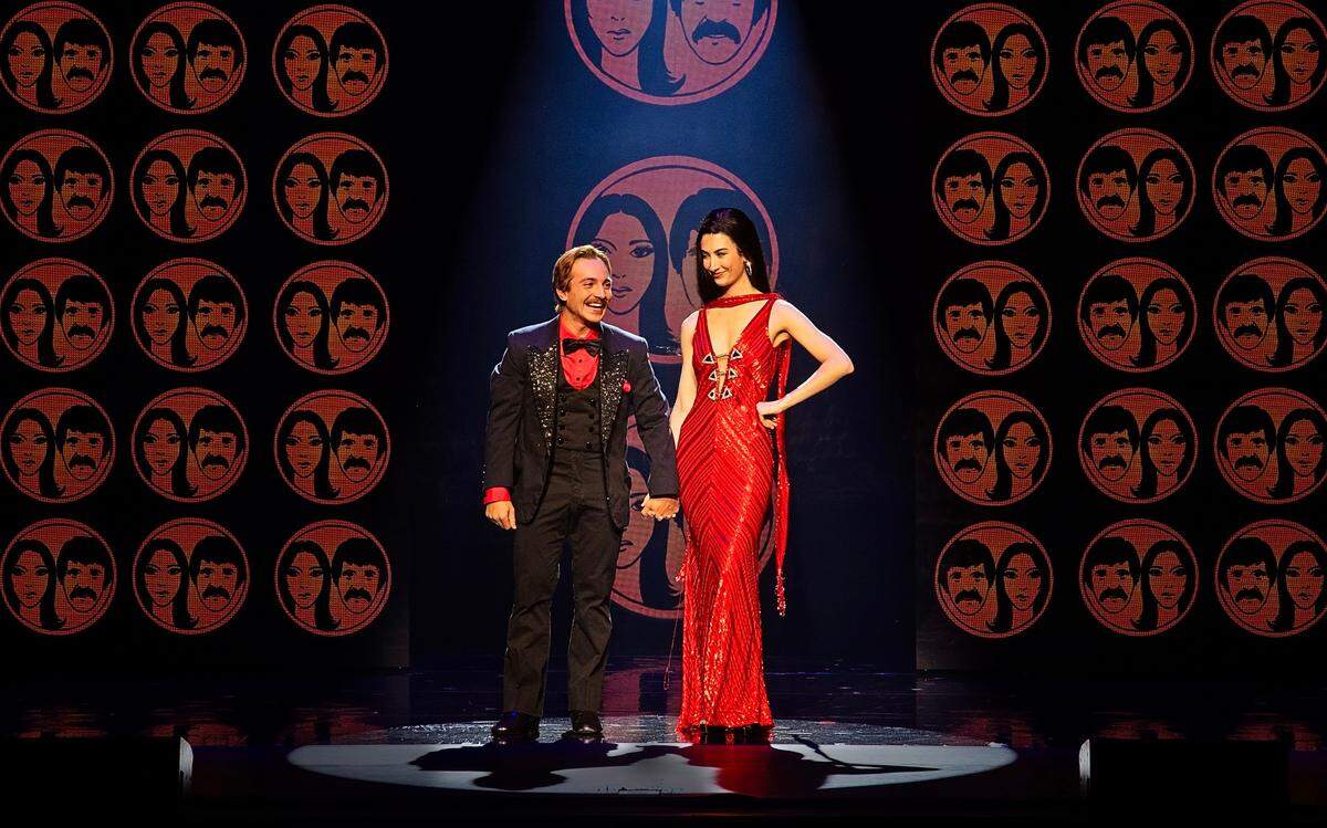 Lorenzo Pugliese as Sonny and Catherine Ariale as Lady in “The Cher Show.”