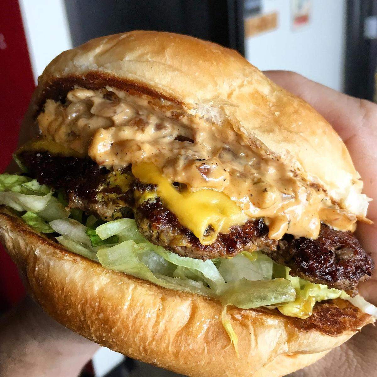 Burgers topped with season ingredients are one of Rob Schauf’s specialties.