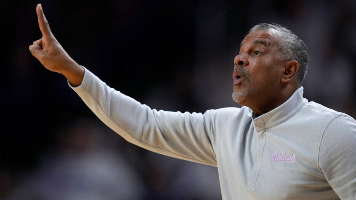 Kansas State head coach Jerome Tang motions to his players during the first half of an NCAA college basketball game against Texas Saturday, Feb. 4, 2023, in Manhattan, Kan. (AP Photo/Charlie Riedel)
